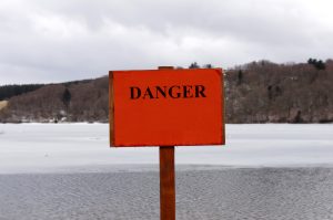 picture of ice and snow with a danger sign. 