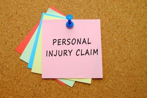 Multi-coloured post it notes with the words 'Personal Injury Claims' written down.