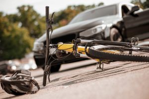 This bicycle accident happened when a car hit it from behind. 